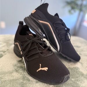 Puma Black Sneakers with Gold Highlights